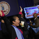 A Ralph Northam supporter celebrates his projected win in Virginia. Image via Getty.